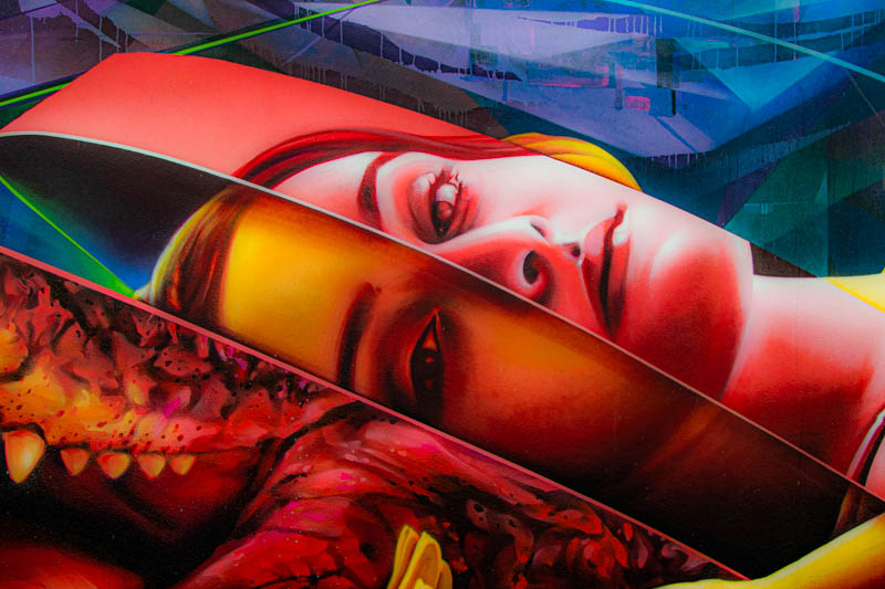 Abstract mural with layered faces and textures